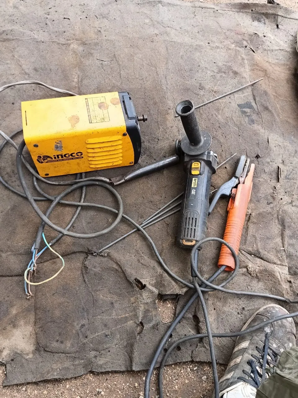 Beka's welding machine, angle grinder, electrodes and welding clamp